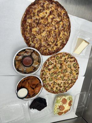 Pizza, hot wings, chocolate cake, dinner salad and toasted ravioli.