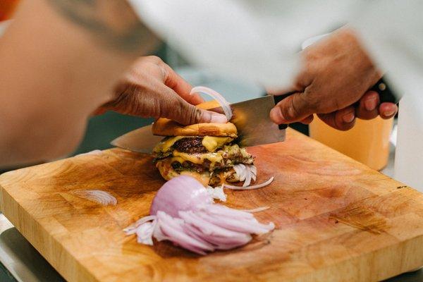 The Burger: double smash beef patty, pickles, onions, American cheese, burger sauce, bun.