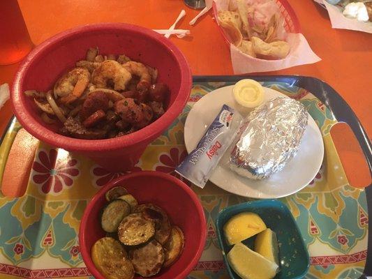 El Molcajete with grilled veggies and a baked potato