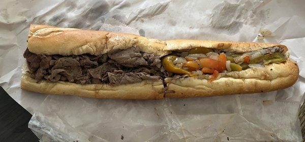 Philly cheesesteak with peppers on half