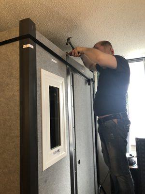 One of Alma-Z's excellent workers affixing the cieling to my professional soundbooth