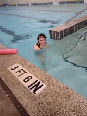 Brooklyn is having fun swimming in the pool!