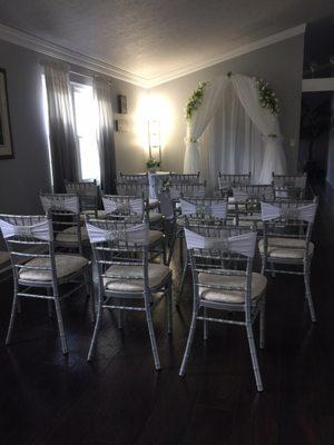 Chairs with sashes and rhinestone accessories.