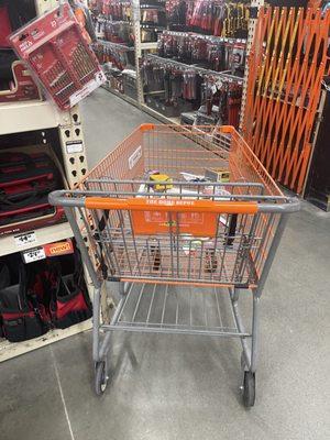 Shopping Cart #1 left by employee partially blocking aisle