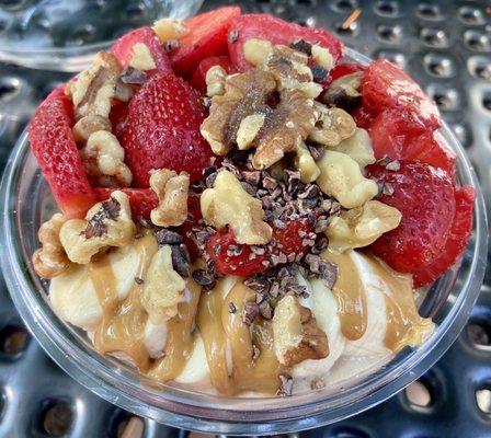 Nica Bowl: granola, strawberries, bananas, walnuts, cocoa nibs, peanut butter