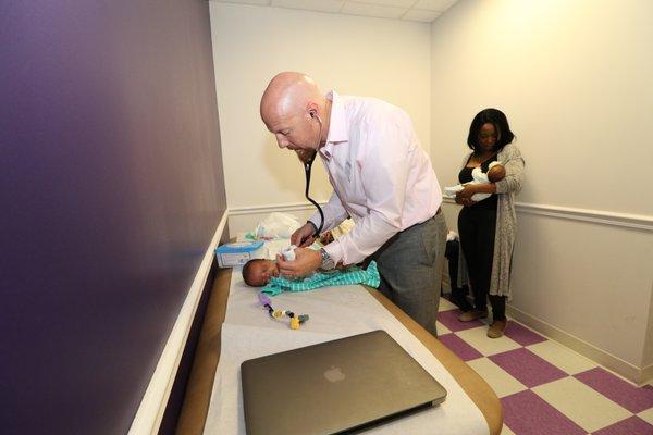 Dr. Parmele with newborn twin patients