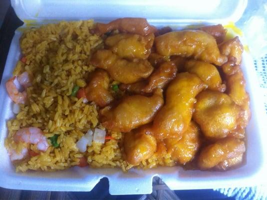 Honey chicken & shrimp rice. Rice is yellow w/ peas & carrots. The chicken (orange-ish) could have been less soggy and sweeter.