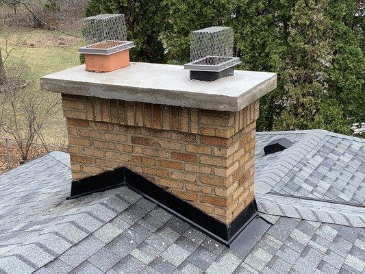 Chimney repainted with new concrete crown.