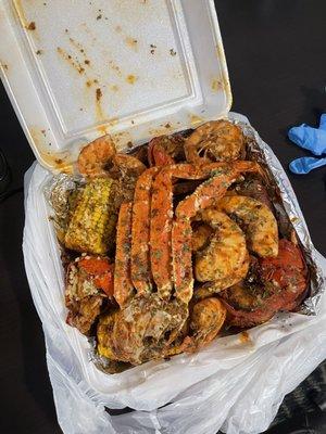 Crabs legs, lobster tails. Shrimp, corn, sausage, potatoes, and rice !!  Bang Bang