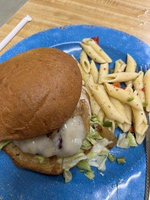 French onion burger with pasta salad.