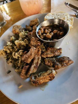 Pork tenderloin bites with wild rice and baked beans