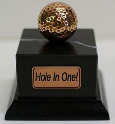 Gold plated and mounted golfball.