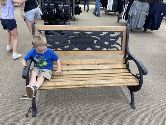 Our 3 year old testing out the bench while daddy, uncle, and Mama were shopping