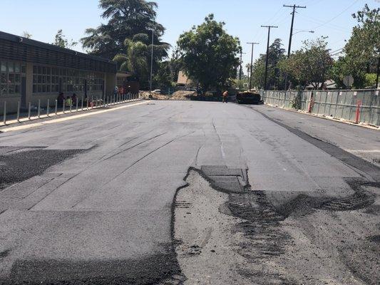 Asphalt work after completing utility upgrade for a whole school