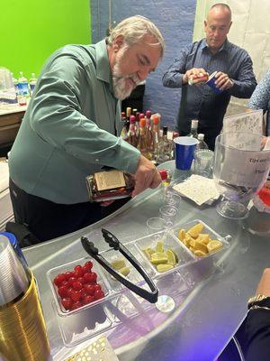 My husband working behind bar at my daughters engagement party