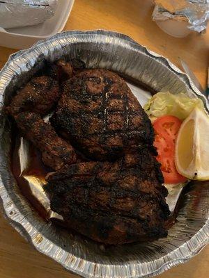 Blackened Ribeye with baked potato, salad & garlic bread.