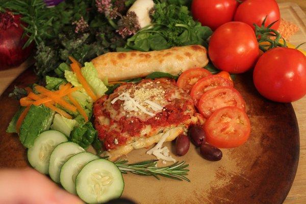 Lasagna comes with a salad and bread stick. Yum.