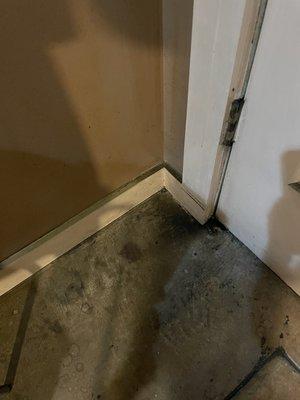 Grime on floor and baseboards