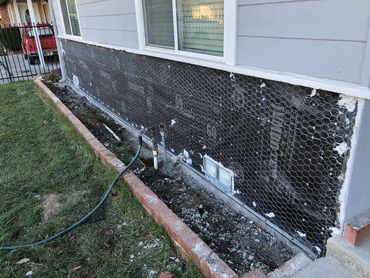 New weep screed and flushing on bottom, new vents, new moisture barrier, and new chicken wire