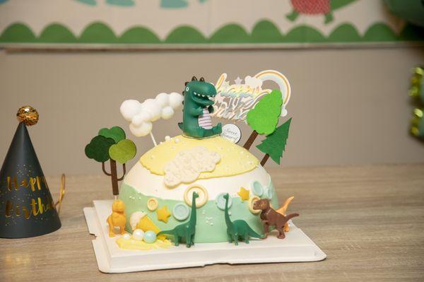 Dinosaur theme custom cake. Mango passion fruit .