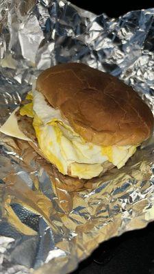 Sausage, two eggs and cheese on a toasted roll