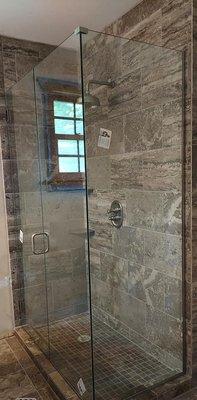 Elevate your bathroom with custom shower door installation services from Suburban Glassworks...