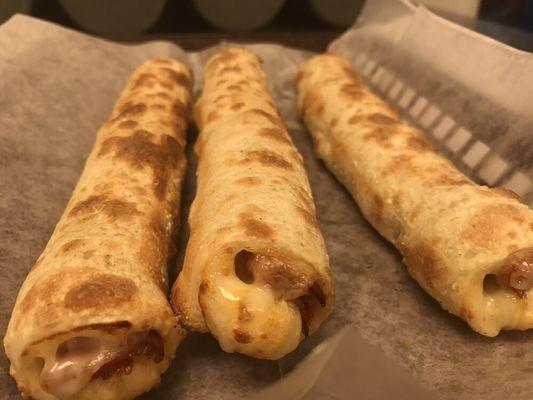 Pepperoni Sticks - our hand-rolled dough (made fresh each day), stretched and filled with pepperoni and mozzarella.