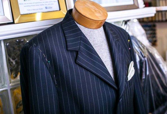 Suit jacket pinned for alterations