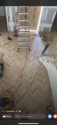 Herringbone hardwood going in!