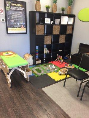 Kids play area and adjusting table.