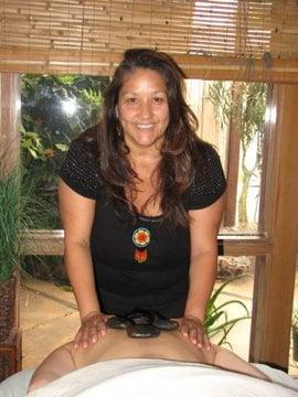 Giving one of my signature massages, Sacred Native Warm Stones!