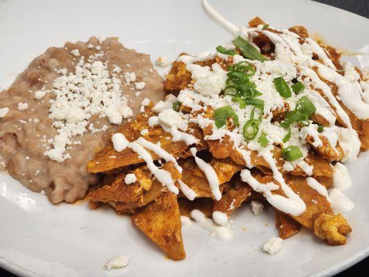 Chilaquiles with a side of refried beans