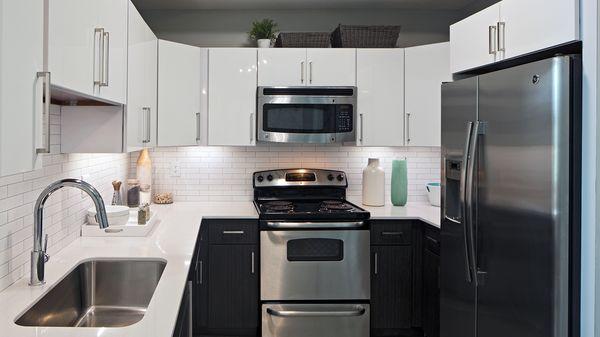 Newly redesigned kitchens with stainless appliances, gas cooktops and custom cabinets