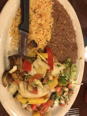 Grilled chicken, vegetables, beans, and rice