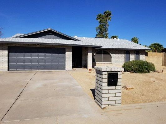 Mailbox and new paint job.  The block on the south side of the house is a lighter gray.