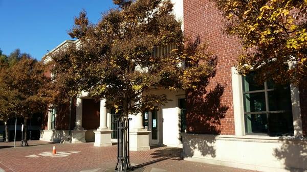 The beautiful brick building next to Starbucks.