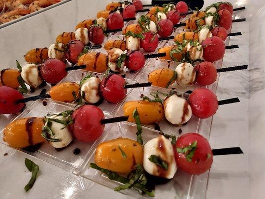 Mini Caprese Salad Skewers 
https://www.divinevisionscatering.com/appetizer-menu-options/