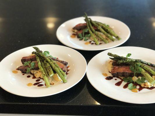 Rib eye cap with cauliflower gratin, grilled asparagus, soy and Meyer lemon reductions