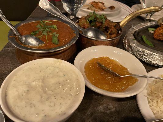 Clockwise from upper left, lamb rogan josh, okra masala, mango chutney, raita.