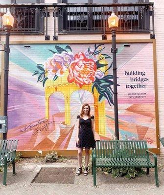 Mural on the exterior of the Kendra Scott store on Walnut street. The Build Bridges Together mural is by Artist Ashley Hodder.