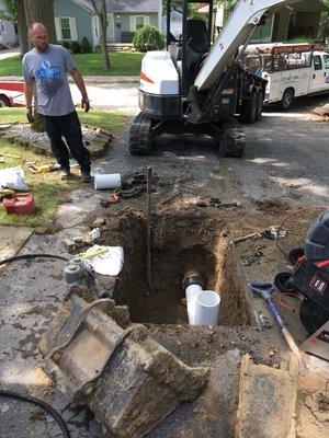 Install clean out in driveway for customer main sewer line.