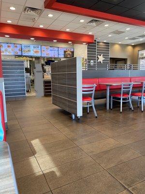 Front counter with menus and kitchen in background