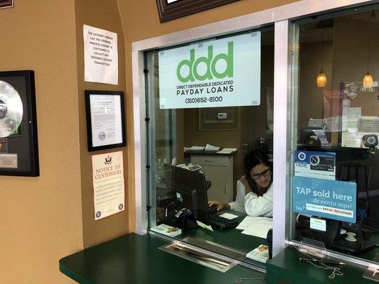 Darlene, owner of DDD, working the window