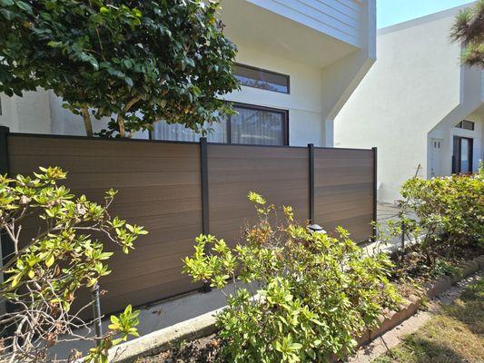 Beautiful Composite Fence in the color Teak. Installed in Santa Monica, CA.