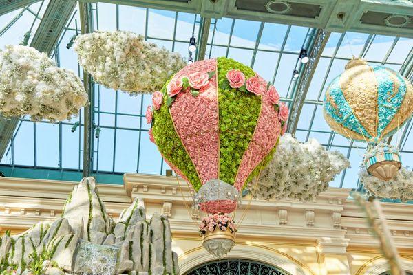 Our stunning flower-covered hot air balloon is a blooming masterpiece, soaring through the sky with elegance and grace.