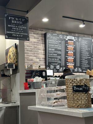 Menu, signs, bread basket.