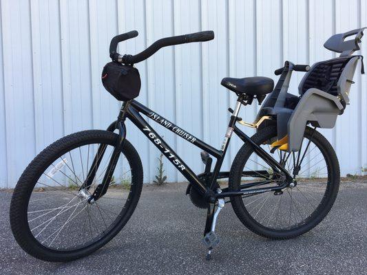 26" Island Cruiser with a child seat attached!