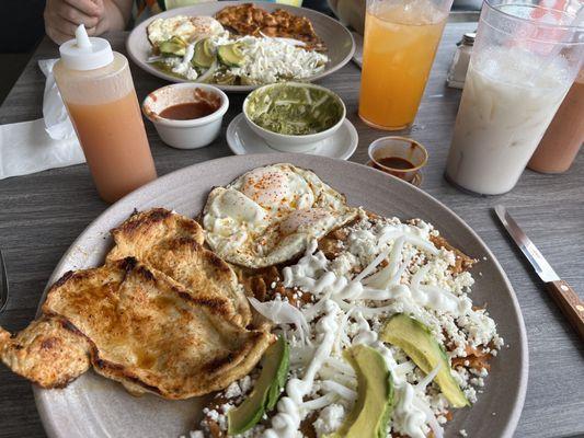 Chilaquiles with a chicken breast, Horchata, salsa and guacamole! Outstanding!