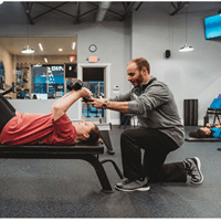 Adam working with a personal training client