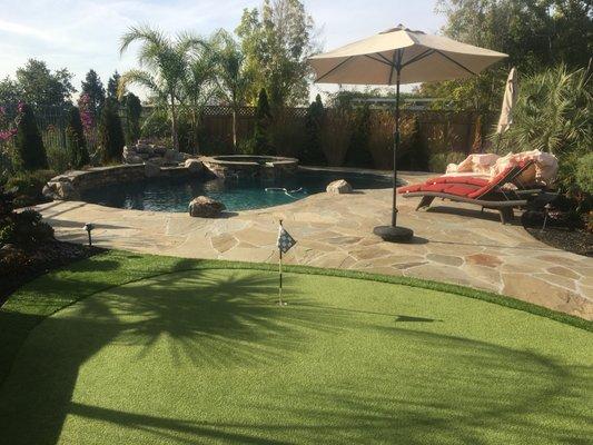 Flagstone pool deck and putting green